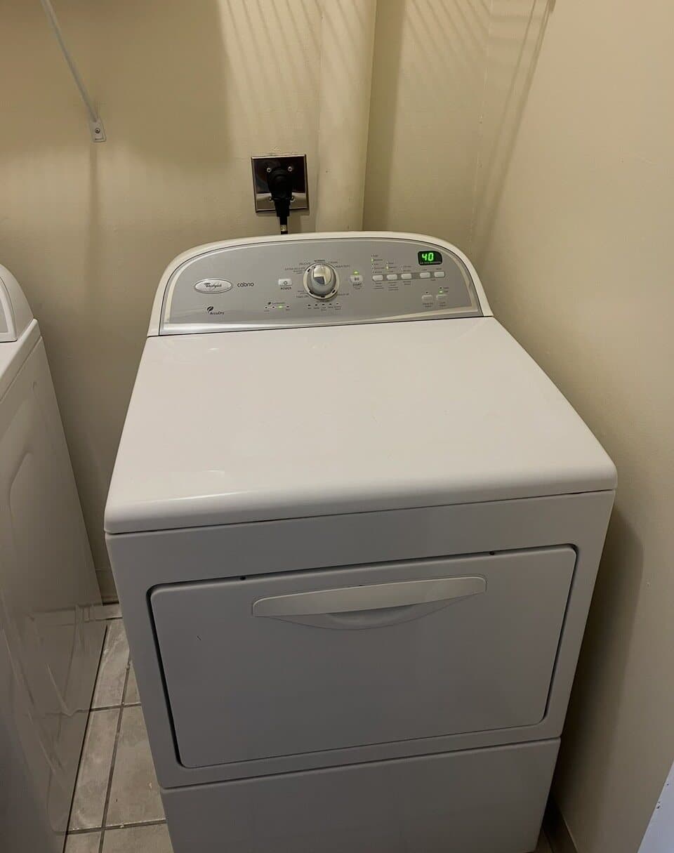 Laundry appliance positioned under an updated electrical outlet